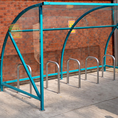 Action shot of green Dudley Cycle Shelter