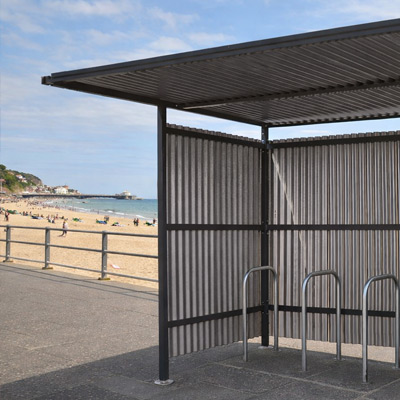 Black traditional Cycle Shelter Galvanised by the beach