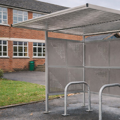 Perforated Traditional Cycle Shelter outside a school